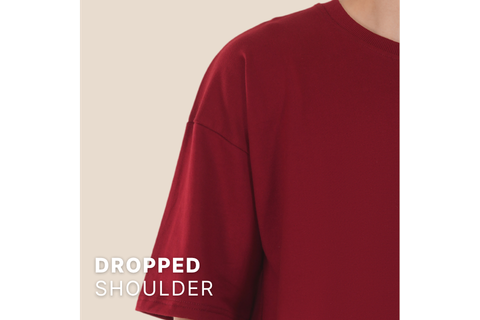 Close up Image of TheCottonStrand Red Oversized Tshirt displaying the characterstic of drop shoulder