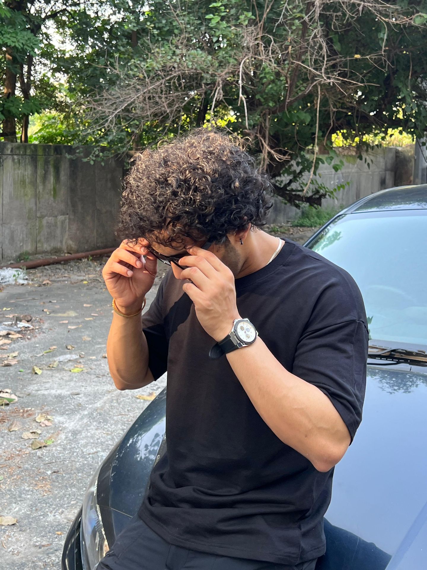 man wearing oversized Black t shirt by TheCottonStrand