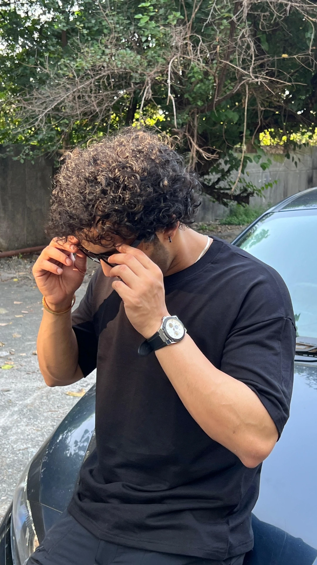 man wearing oversized Black t shirt by TheCottonStrand