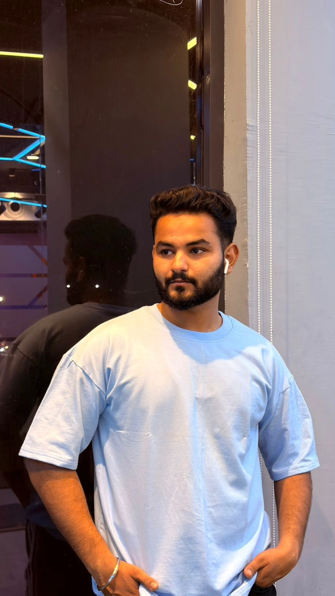 man wearing oversized Light Blue t shirt by TheCottonStrand