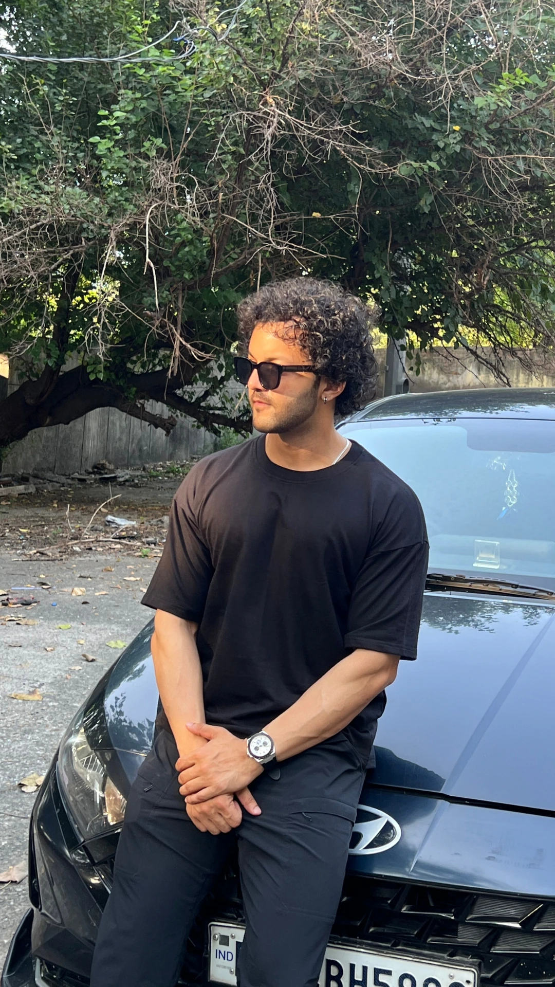 man wearing oversized Black t shirt by TheCottonStrand